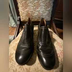 Dark brown leather Montana short boots with zipper closure.